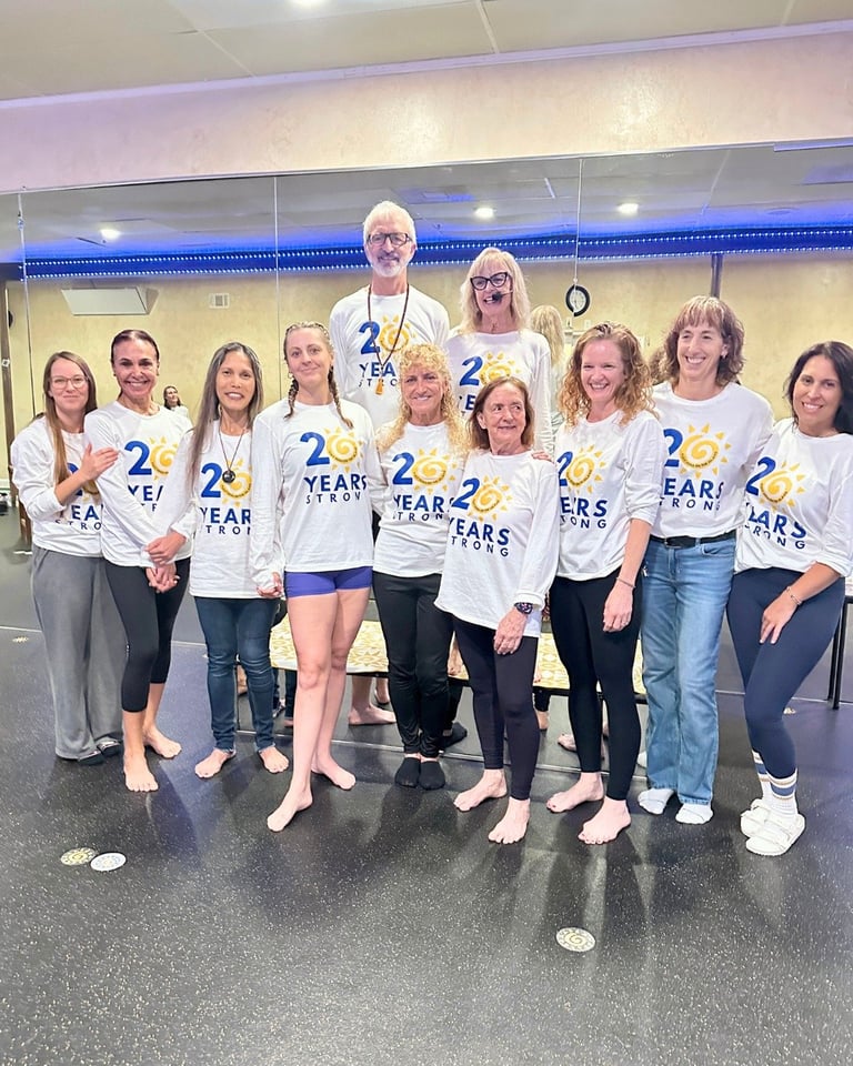 Group of people wearing 2 Years Strong t-shirts posing together