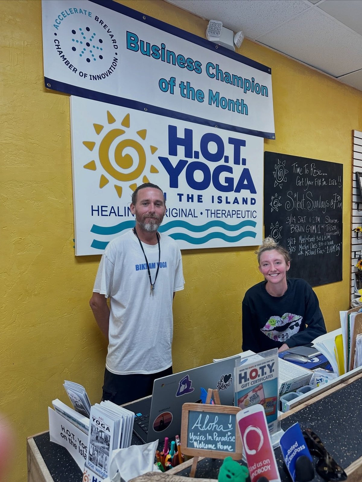 H.O.T. Yoga studio counter displaying Business Champion of the Month award